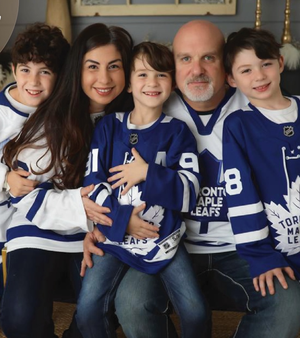 Ida Li Preti with her husband and their three sons wearing Toronto Maple Leafs jerseys