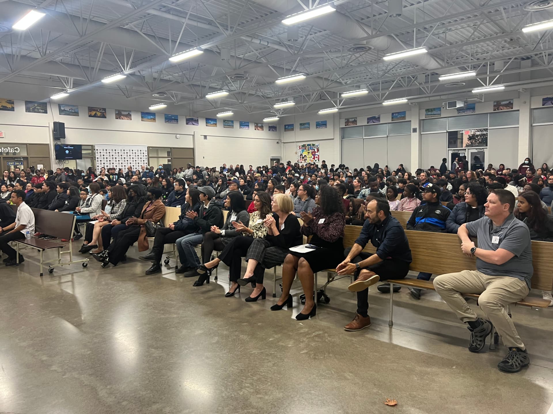 Families and students filling a school cafeteria at a Ward 3 parent engagement evening