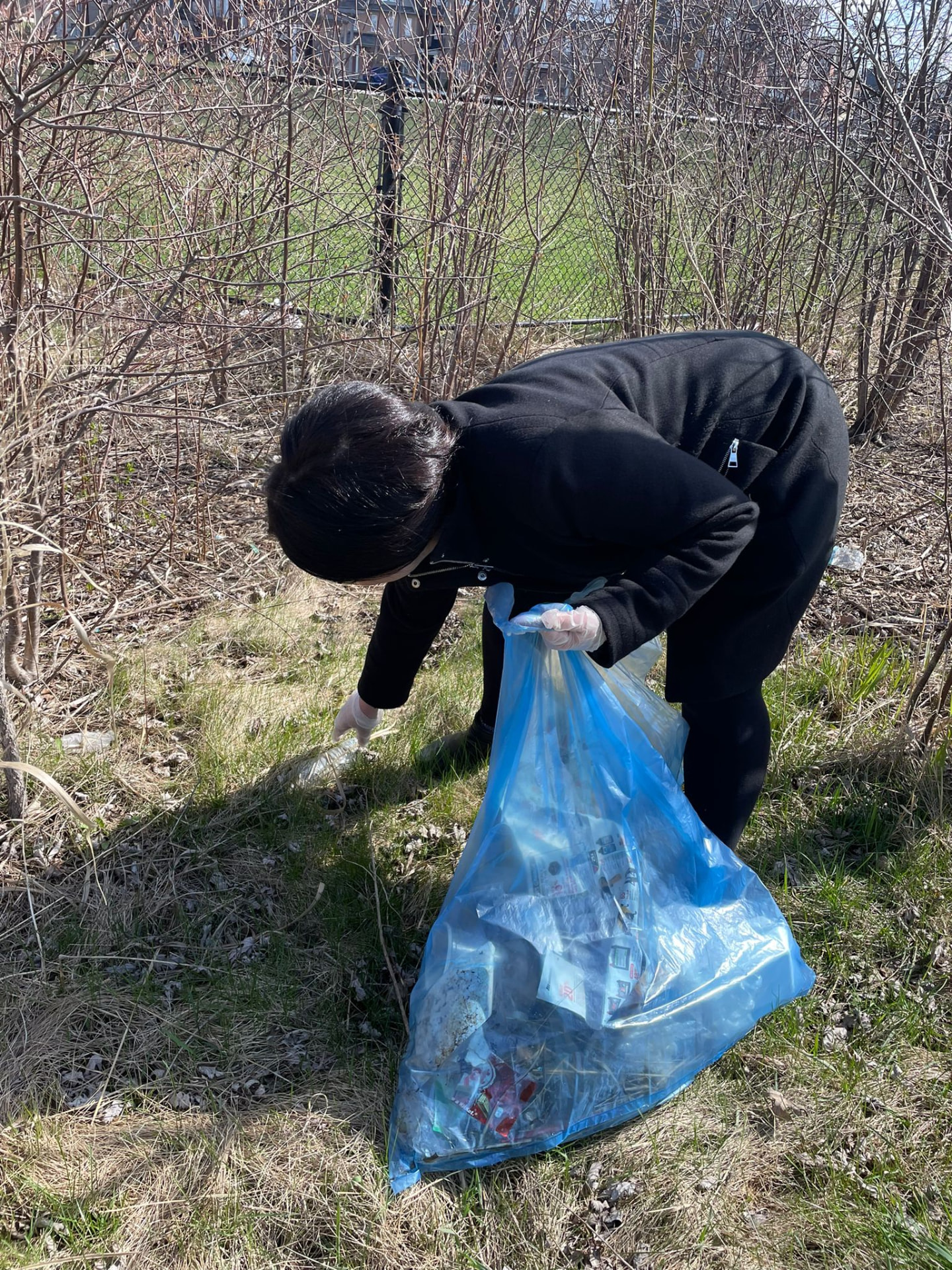 Students and volunteers taking part in a community cleanup